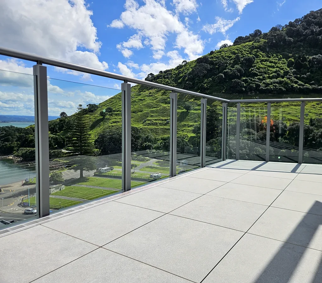 Glass balustrade on a Mount Maunganui apartment terrace with views of Mauao